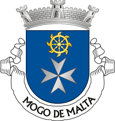 Escudo de azul, cruz da Ordem de São João de Jerusalém, dita de Malta; em chefe, roda de navalhas de ouro. Coroa mural de prata de três torres. Listel branco, com a legenda a negro: «MOGO de MALTA».