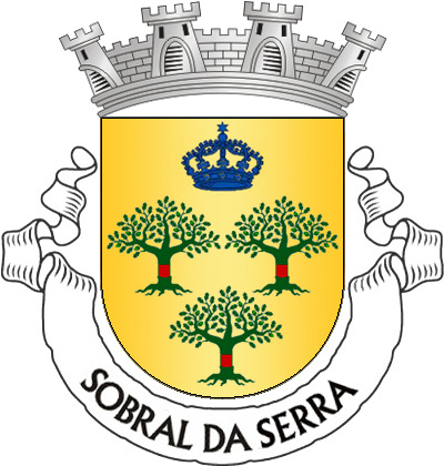 Escudo de ouro, três sobreiros arrancados, de verde, descortiçados de vermelho; em chefe, coroa mariana de azul. Coroa moral de prata de quatro torres. Listel branco, com a legenda a negro: "Sobral da Serra".