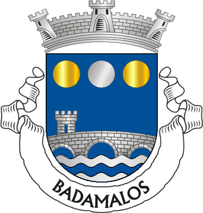 Escudo de azul, ponte de três arcos torreada à dextra, de prata, lavrada de negro, movente dos flancos e saínte de ponta ondada de prata e azul de três burelas; em chefe, besante de prata entre dois besantes e ouro. Coroa mural de prata de três torres. Listel branco, com a legenda a negro: "BADAMALOS". 