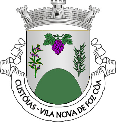 Escudo de prata, monte de verde movente da ponta, entre ramo de amendoeira de verde, florido de púrpura e ramo de oliveira de verde, frutado de negro, postos em pala; em chefe, cacho de uvas púrpura, folhado de verde.  Coroa mural de três torres.  Listel branco, com a legenda a negro: «CUSTÓIAS- VILA NOVA DE FOZ CÔA». 