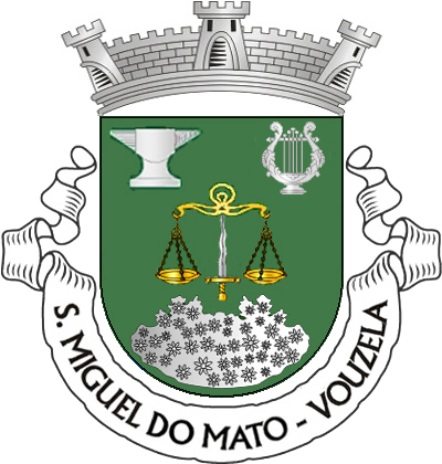 Escudo verde, balança de ouro sustida por espada de lâmina flamejante de prata, empunhada de ouro, acompanhada em chefe por uma bigorna e uma lira e, em ponta, por uma mata, tudo de prata.
Coroa mural de prata de três torres, Listel branco, com a legenda a negro: «S. Miguel do Mato — Vouzela».