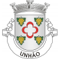 Escudo de prata, uma caderna de crescentes de vermelho, acantonada de quatro cachos de uvas de ouro, folhados de verde. Coroa mural de prata de quatro torres. Listel branco, com a legenda a negro: "UNHÃO". 