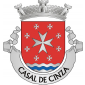 Escudo de vermelho, com uma cruz da Ordem de Malta circundada por oito cruzetas da mesma Ordem de prata; campanha diminuta ondada de prata e azul de três tiras ondadas. Coroa mural de prata com três torres aparentes. Listel de prata com a legenda a negro:«CASAL DE CINZA».