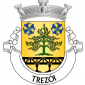 Escudo de ouro, cedro-do-Buçaco de verde, arrancado do mesmo e frutado do campo, entre duas armações de moínho de azul, vestidas e encordoadas do mesmo; em campanha, ponte ferroviária de negro, firmada nos flancos e saínte da ponta. Coroa mural de prata de três torres. Listel branco, com a legenda a negro: "TREZÓI". 