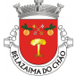 Escudo de vermelho, árvore arrancada de ouro, acompanhada em chefe por duas chaves passadas em aspa uma de ouro e uma de prata, com os palhetões para o chefe e entre duas laranjas de sua cor, folhadas de verde e realçadas de ouro. Coroa mural de três torres de prata. Listel branco, com a legenda a negro, em maiúsculas: «BELAZAIMA DO CHÃO».