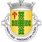 Escudo de ouro, cruz de ramos de sobreiro de verde, folhados e landados do mesmo, acompanhada no cantão dextro por cruz da Ordem de Santiago. Coroa mural de prata de três torres. Listel branco, com a legenda a negro: «SANTA CRUZ - SANTIAGO do CACÉM». 