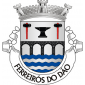 Escudo de prata, com uma ponte de quatro arcos de negro, lavrada do campo, firmada nos flancos e movente de campanha ondada de azul e prata de cinco peças; em chefe, bigorna de negro, entre duas marretas do mesmo, encabadas de vermelho. Coroa mural de prata de três torres. Listel branco, com a legenda a negro: 