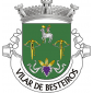 Escudo de verde, Agnus Dei de prata, nimbado de ouro e sustendo com a pata direita uma haste crucífera de ouro com lábaro de prata carregado de uma cruz firmada de vermelho, duas bestas de ouro cordoadas de prata e realçadas de negro e três espigas de milho de ouro, postas uma em banda, uma em pala e uma em barra, atadas de prata e moventes de um cacho de uvas de púrpura folhado de prata, todas as figuras alinhadas em cruz. Coroa mural de prata de três torres. Listel branco, com a legenda a negro: “VILAR DE BESTEIROS“. 