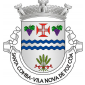 Escudo de prata, faixa ondada de azul, carregada de faixeta ondada de prata e acompanhada em chefe de cruz da Ordem de Cristo, entre dois cachos de uvas de púrpura, folhados de verde e, em campanha, de um feixe de cinco espigas de trigo de verde atado de vermelho. Coroa mural de prata de três torres. Listel branco, com a legenda a negro: "Santa Comba - Vila Nova de Foz Côa".