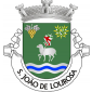 Escudo de verde, Agnus Dei de prata, com lábaro de prata com cruz firmada de vermelho; em chefe, à dextra, cacho de uvas de ouro, folhado de prata e, à sinistra, ramo de oliveira de ouro, frutado de prata; em campanha, faixa ondada de três burelas de prata e azul. Coroa mural de prata de três torres. Listel branco, com a legenda a negro: «S. JOÃO de LOUROSA». 