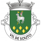 Escudo de verde, Agnus Dei de prata, nimbado de ouro e sustendo haste crucífera do mesmo, com lábaro de prata carregado de uma cruz firmada de vermelho; em ponta, cinco lisonjas de ouro, alinhadas em faixa e dispostas três, duas. Coroa mural de prata de três torres. Listel branco, com a legenda a negro: "VIL DE SOUTO". 