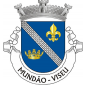 Escudo de azul, banda de prata de cinco ordens, empedrada, lavrada de negro, acompanhada de flor-de-lis de ouro à dextra e coroa real antiga, aberta, de ouro, à sinistra. Coroa mural de prata de três torres. Listel branco com a legenda a negro em maiúsculas : “MUNDÃO - VISEU“. 